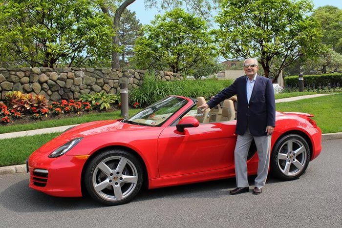 Simon Barchi with a red car